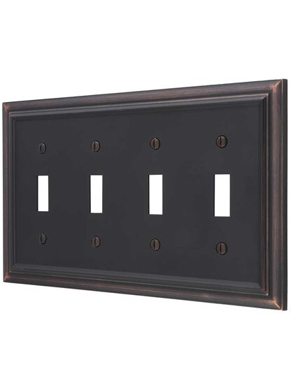 Georgian Quad-Toggle Switch Plate in Aged Bronze.